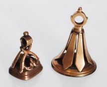Two 19th Century 9ct gold fob seals, one set with an onyx panel engraved with a cherub and a dog,
