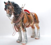 A large vintage 20th Century ceramic figure ornament of a shire horse in the manor of Beswick having