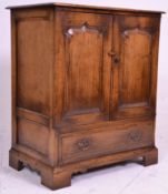 A good quality oak Tv / Cocktail cabinet in the manner of Rackstraw. Raised on block feet with short