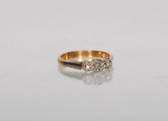 A stamped 9ct gold ring illusion set with three round cut white stones. Weight 2.2g. Size K.5.