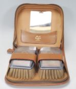 A pair of vintage silver hallmarked clothes brushes, having engine turned decoration with raised
