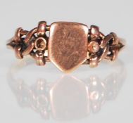 A hallmarked 19th Century Victorian 22ct gold ring having an unmarked armorial cartouche with