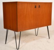 A stunning Danish retro vintage teak wood twin door cupboard having a shelved interior, each door