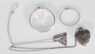 A collection of silver to include a box link chain adorned with heart shaped perfume / smelling