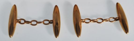 A pair of vintage gents gold torpedo shaped cufflinks stamped 18, housed within a leather