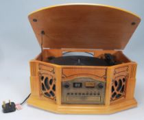 A contemporary antique style hi-fi stereo system in oak wooden effect, The system comprising tape