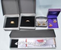 A selection of gentleman's jewellery to include a stamped 925 silver flat link bracelet with a
