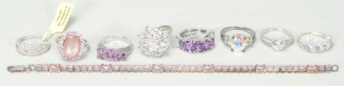 A selection of ladies silver jewellery to include a pink stone tennis bracelet, a five stone ring
