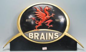 A large advertising point of sale brewery / pub sign for Brains Brewery having an ebonised ground