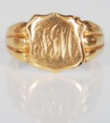 A hallmarked 18ct gold signet ring having an armorial crest to the head engraved with initials