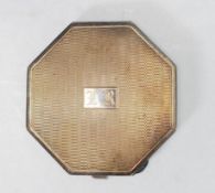 A vintage 20th Century English silver hallmarked compact of octagonal form having an engine turned