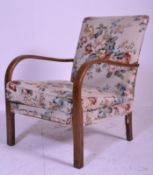 An early 20th century bentwood armchair in the manner of Halabala. Chintz upholstered sprung chair