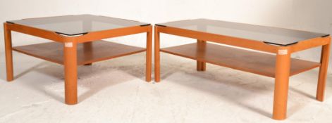 Two vintage retro 1970's Meyers teak wood coffee tables having rounded legs with lower shelves and