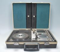 A vintage retro Sanyo Solid State Stereo Music Center model G-2515N-2. Housed within the black carry