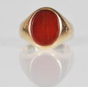 A vintage 9ct yellow gold hallmarked signet ring dating to the 20th Century fitted with a