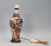 A 20th Century Chinese crackle glaze lamp base of baluster form decorated with hand painted green