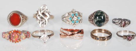 A collection of Silver rings including a .925 silver ring inset with an iridescent feature stone,