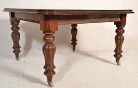 A good 19th century Victorian mahogany extending dining table having a square large top with