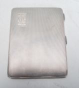 A vintage 20th Century English silver hallmarked cigarette case of rectangular form having engine