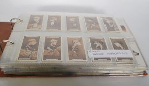 An album of John PLayers cigarette trade cards in full sets. Complete sets include Racing