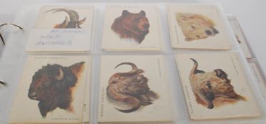 An Album of vintage John Players cigarette trade cards. Full sets include Cap Badges, Wild Animals