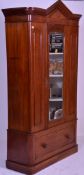 A Victorian 19th century mahogany single wardrobe armoire. Raised on a plinth base with deep
