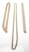 Three gold plated gentleman's necklace chains to include a flat link necklace together with a