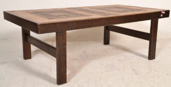 A 20th Century Danish retro vintage tile topped coffee table of rectangular form having a