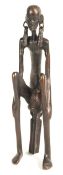AFRICAN BRONZED FIGURAL STATUE OF A SEATED WOMAN