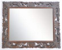 19TH CENTURY FLORENTINE REVIVAL CARVED OAK WALL MIRROR
