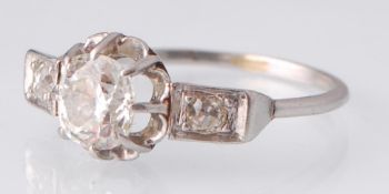 A French Art Deco Platinum Three Stone Diamond Ring