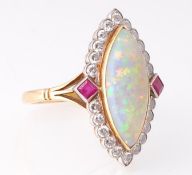 A French 18ct gold opal diamond and ruby ring. The ring set with a marquise opal cabochon surrounded