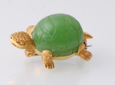 An 18ct gold French novelty brooch. The brooch in the form of a turtle having a carved green