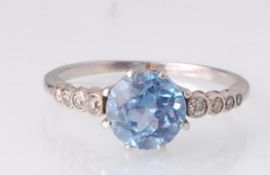 A 1920s spinel and diamond ring. The ring set with a central pale blue spinel - likely synthetic -