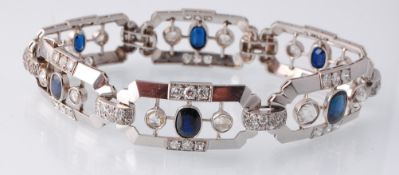 A French Art Deco gold, platinum, sapphire and diamond bracelet. The bracelet having 6 geometric