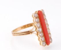 An 18ct gold 19th century coral and diamond ring. The ring having a central cabochon of coral