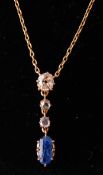 An early 20th century sapphire and diamond pendant necklace. The necklace strung with an oval cut