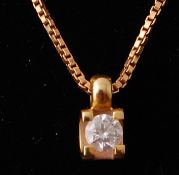 An 18ct gold and diamond pendant necklace. The necklace a box chain strung with a solitaire