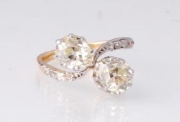 A French diamond toi et moi diamond ring. The ring set with two pear old cut diamonds, prong set