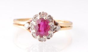 18CT GOLD RUBY AND DIAMOND CLUSTER RING