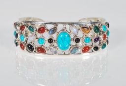 A substantial and unusual large silver bangle bein