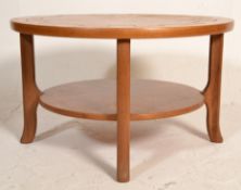 A 1960's retro vintage teak wood round two tier co