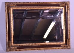 A contemporary antique style gilded and faux red l