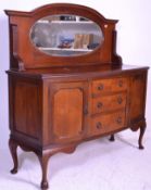 An Edwardian mahogany mirror back sideboard raised