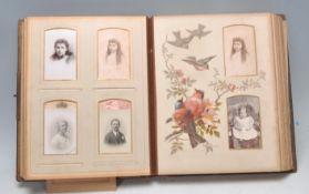 A 19th Century Victorian leather bound embossed photograph album having hand painted pages of