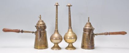 Two vintage early 20th Century middle eastern Persian Islamic brass coffee pot / Dallah, one