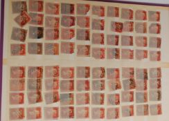 A stamp album consisting largely of Victorian stamps including penny reds neatly laid out well in