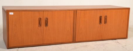A vintage / retro 20th Century G Plan low teak wood sideboard credenza having two twin door cupboard