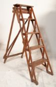 A good early 20th century Industrial wooden a-frame folding ladder with trestle ends complete with