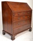 A good 19th Century Georgian mahogany bureau desk. The fall front revealing a fitted interior of